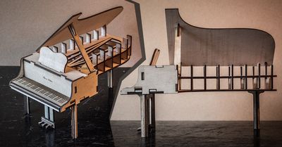 two pictures of the model piano made out of lasercut plywood